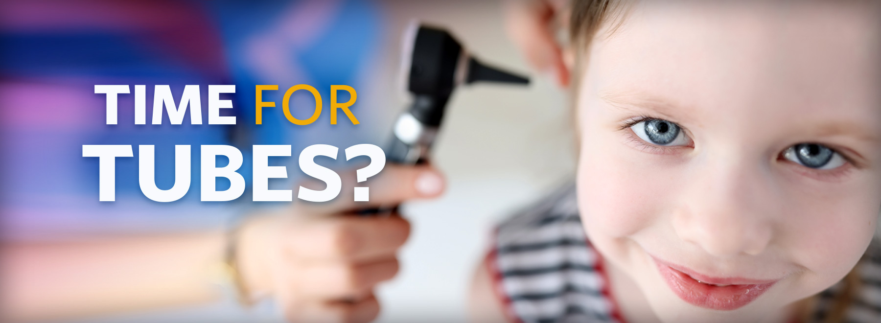 Child with ear being checked for infection scope